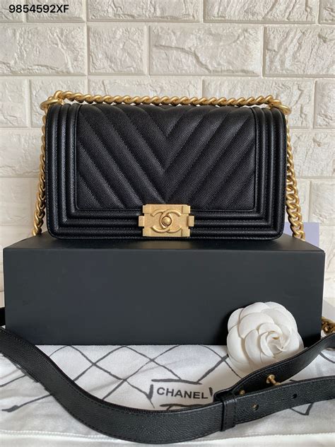 chanel boy bag medium black gold|More.